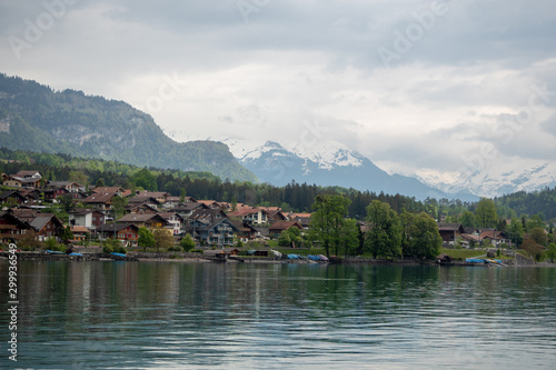 Charming scene of village beside the lake Brienz on cloudy sky and mountain background with copy space, Switzerland
