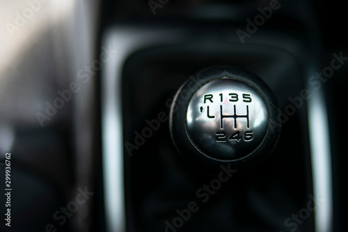 Manual transmission gear shift, on dark backgroun in an european car