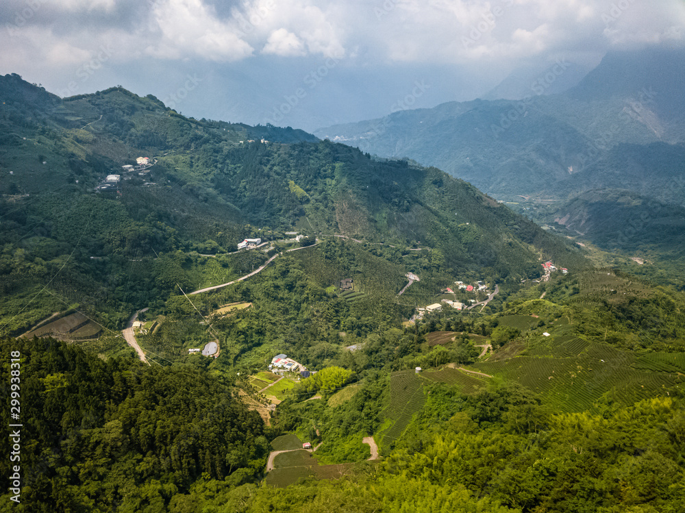 Aerial View of Beautiful Green Scenic Valley with Settlements near Alishan Scenic Area in Taiwan