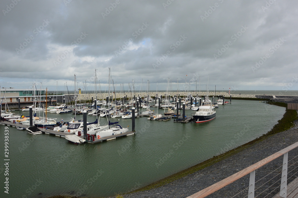 Cadzand (Holland). August 2017.  Artificial bay. Mooring for boats and boats.