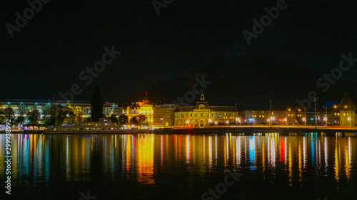 Light reflections of the building falling on lake lucerne © Tutun