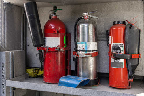 Fire extinguisher in fire truck side compartment.