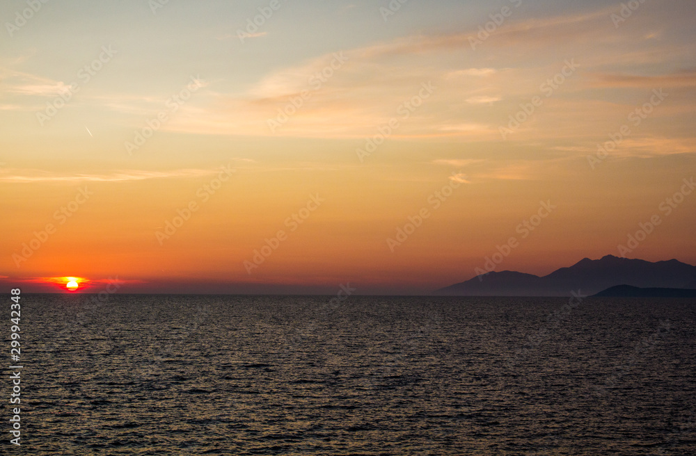 sunset at sea and mountains