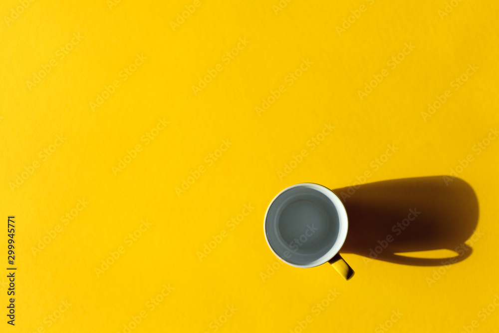 empty сup on a yellow background