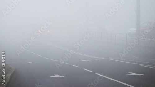 Highway in the morning during heavy fog. Traffic is complicated_