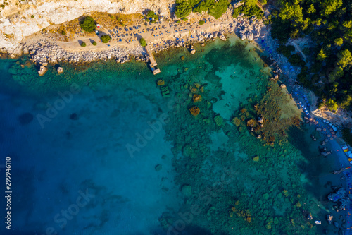 Fototapeta Naklejka Na Ścianę i Meble -  top view from drone to shore with beach of Anthony Queen Bay, Greece Rhodes, popular tourist destination.