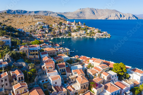 Symi, Dodecanese island, Greece. Beautiful bay with colorful houses on the hillside of famous popular tourist spot island of Symi © vladimircaribb