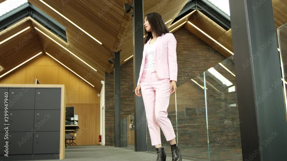 Bullet time shot of stressed businesswoman expressing shock & realising a mistake, in modern corporate office
