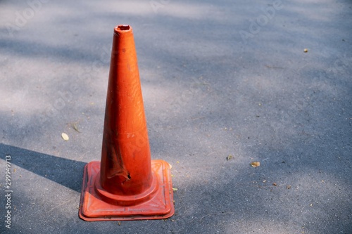 Old Traffic cone on the road Background close up