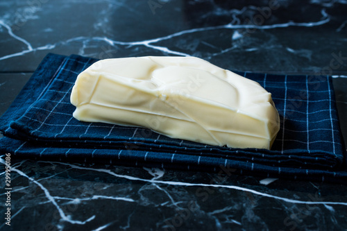 Turkish Cheese Abaza Peyniri on Black Tablecloth. photo