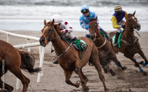 Horse racing action on the beach , west coast of Ireland