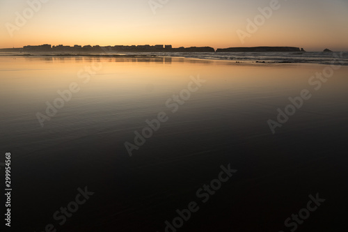 Sunset at Baleal beach with the baleal island in the background in Peniche  Atlantic coast of Portugal.