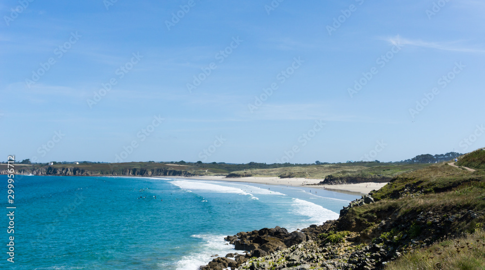 Plage des Blancs Sablons beach on the west coast of Brittany landscape view with surfers