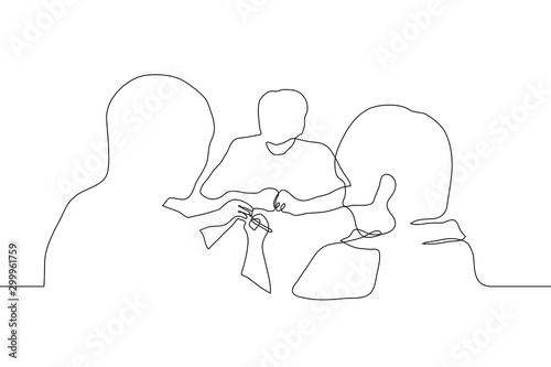 continuous line drawing the silhouette of three men sitting at a table, one of whom is holding a pen over a sheet of paper. It can be used for animation. Vector