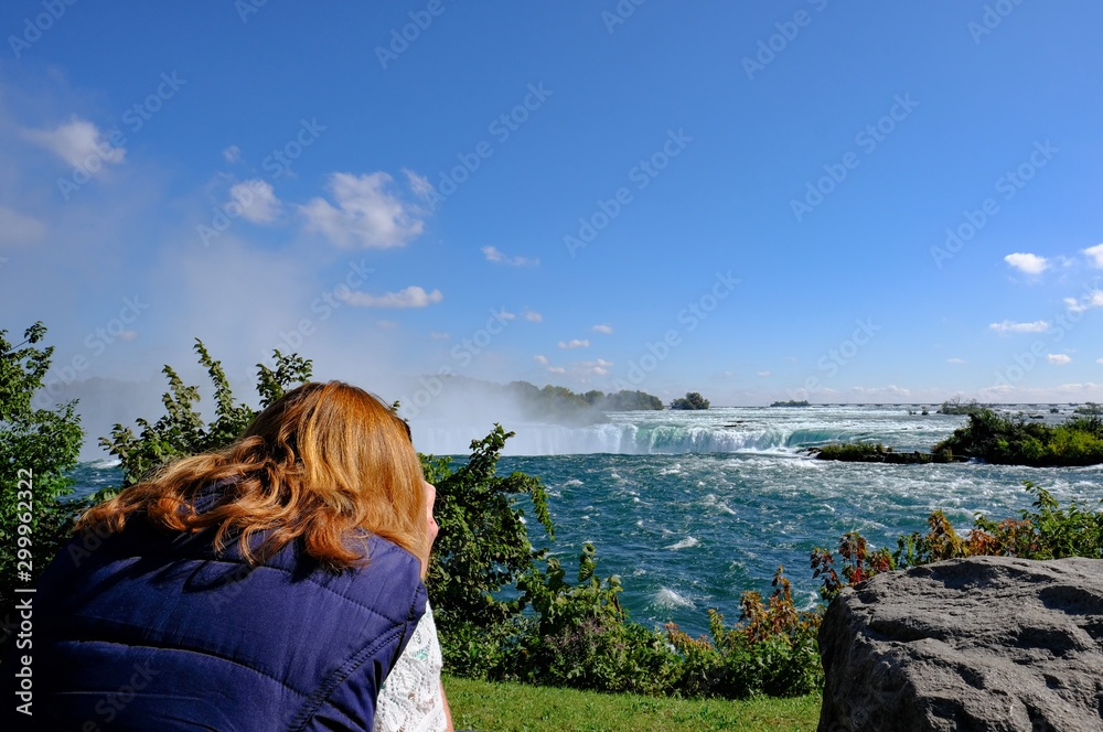 Woman tourist seen taking photo's of the famous North American Falls. Woman tourist seen taking photo's of the famous North American Falls.