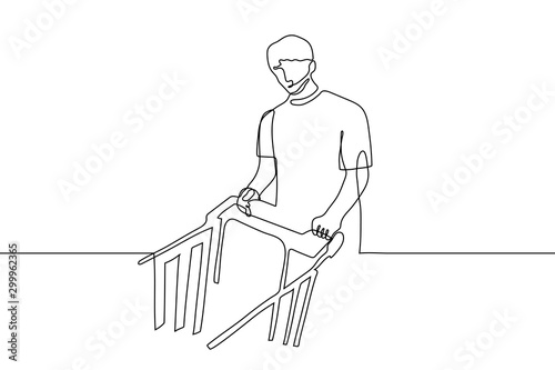 continuous line art man with a grocery cart looks at the viewer. Season purchases, purchases before the holidays, sale of goods. Can be used for animation. Vector