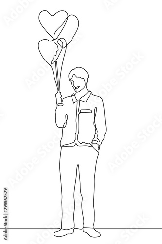 continuous one line drawing Young smiling man holds heart shaped balloons. A full-length silhouette of a man stands relaxed.The concept of kindness, openness, love.It can be used for animation. Vector