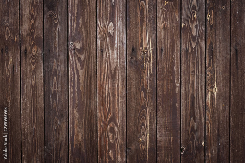 Old timber planks. Wood material, texture. Wooden rough surface. Dark board pattern, grunge fence. Hardwood natural background. Brown fence with a knots and nails. Timber plank. Dirty wall backdrop. 
