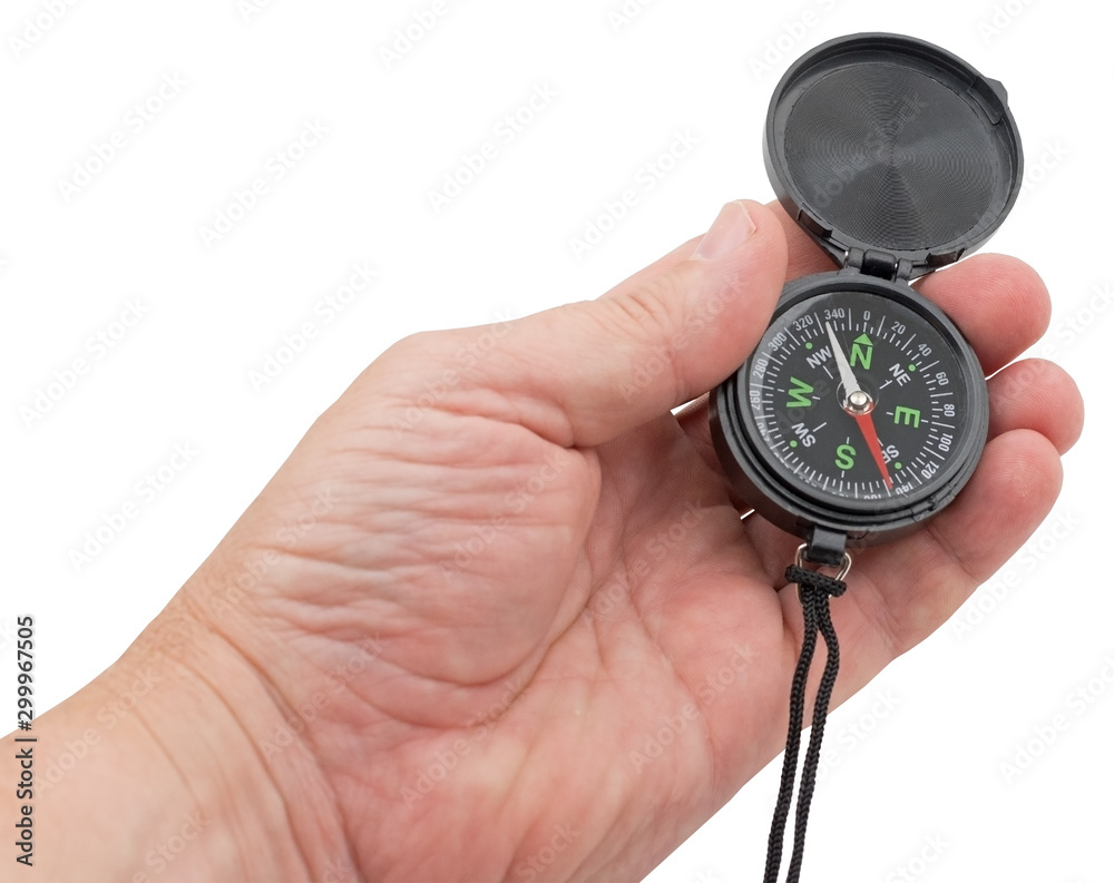 compass in hand on a white background compass in hand on a white background