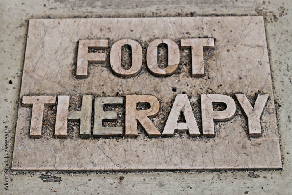 Foot Theraphy signage on the floor Foot Theraphy signage on the floor