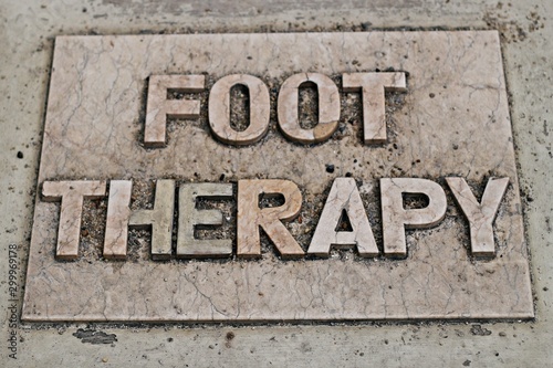 Foot Theraphy signage on the floor
