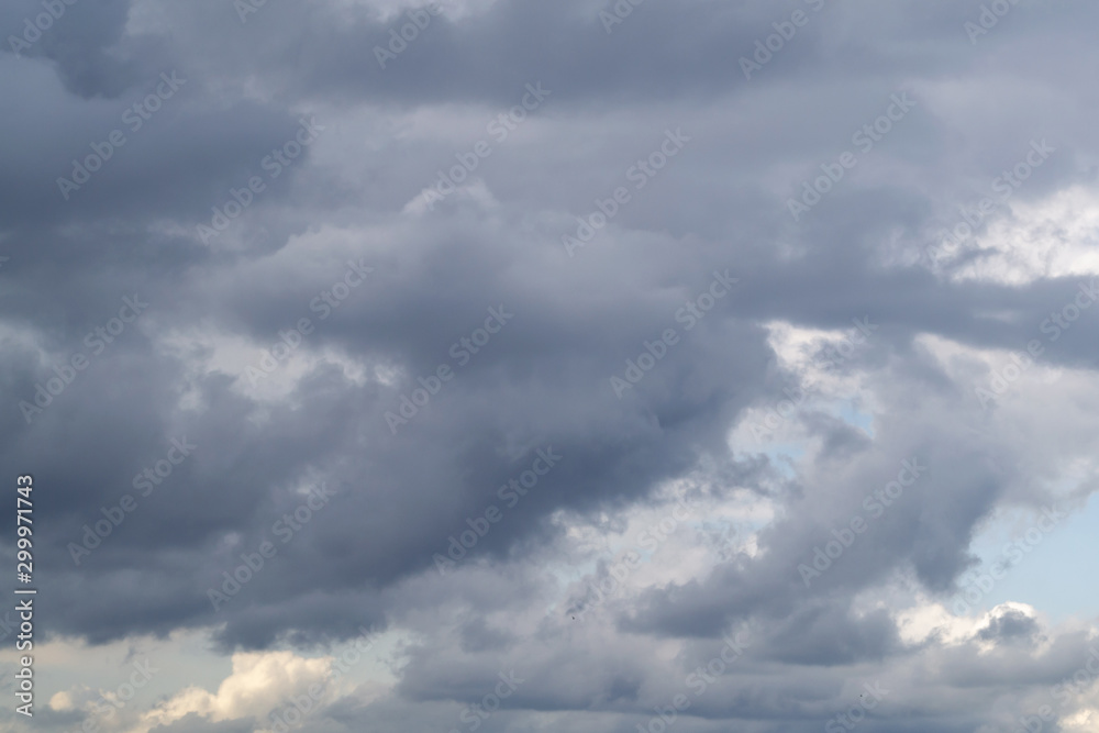 Gray clouds in rainy sky. Сontrast bright background.