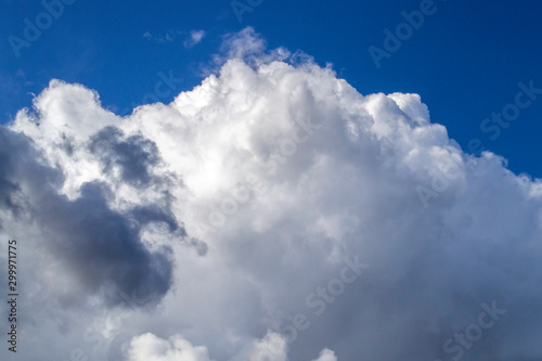 White and gray clouds in sunny sky.   ontrast bright background