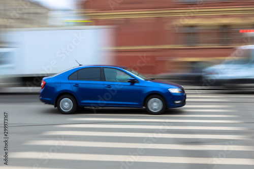 blue car on the road © Olga
