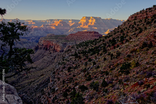 Grand Canyon view near sundown from the Grandview Trail about halfway between Horseshoe Mesa and Grandview Point. The trail is 3 miles long and rated as difficult. The haze is from a nearby wildfire. photo