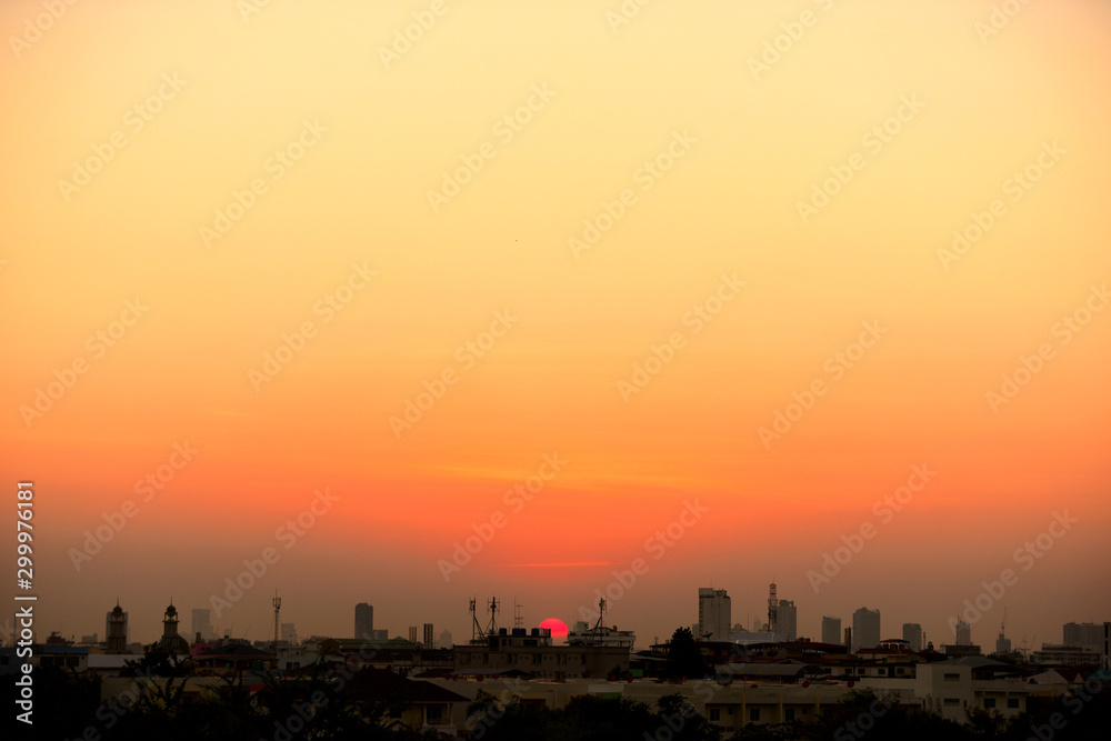 Sunset view Beautiful golden yellow sky in big cities	