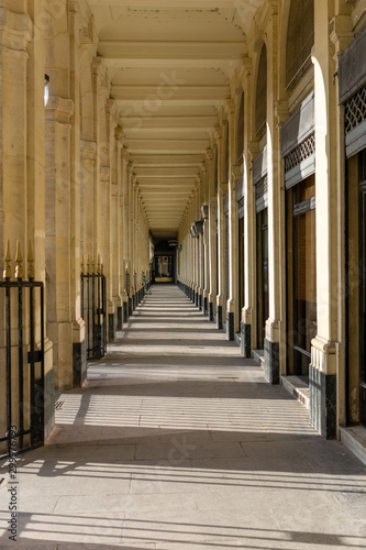Column corridor in Palais Royal, Paris. France. 