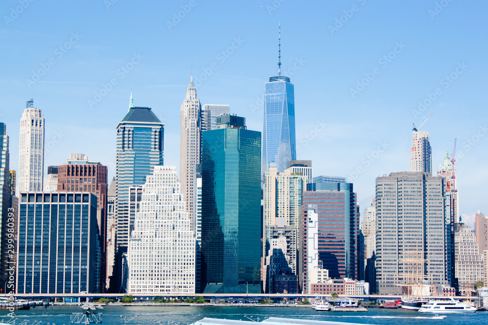 Fototapeta premium New - York Manhattan city view with skyscrapers and blue sky 