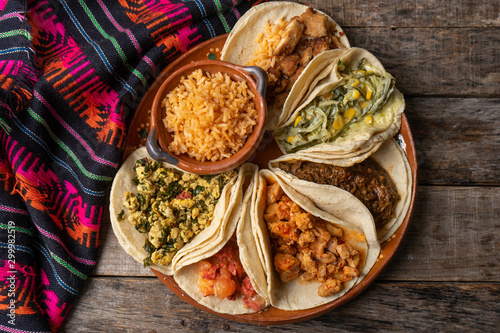 Принти на полотні Mexican stew tacos also called guisados with rice on wooden background