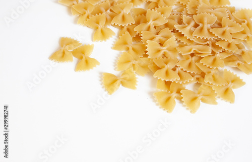 Italian food. Pasta in the form of bows on a white background. Pasta farfalle