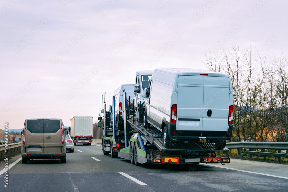 Naklejka premium Minivan carrier transporter truck in road