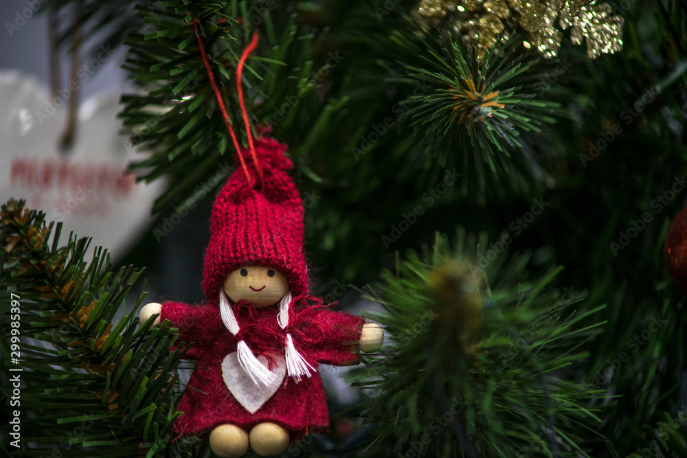 Christmas tree decorations, elves, gnomes, balls and hearts hanging on the Christmas tree. Colorful lights. Christmas tree decorations, elves, gnomes, balls and hearts hanging on the Christmas tree. Colorful lights.