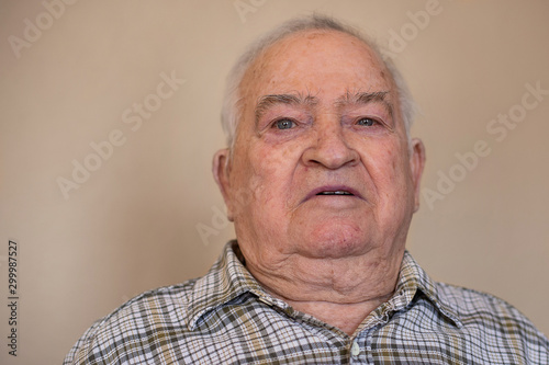 Portrait of an elderly man with thankful
