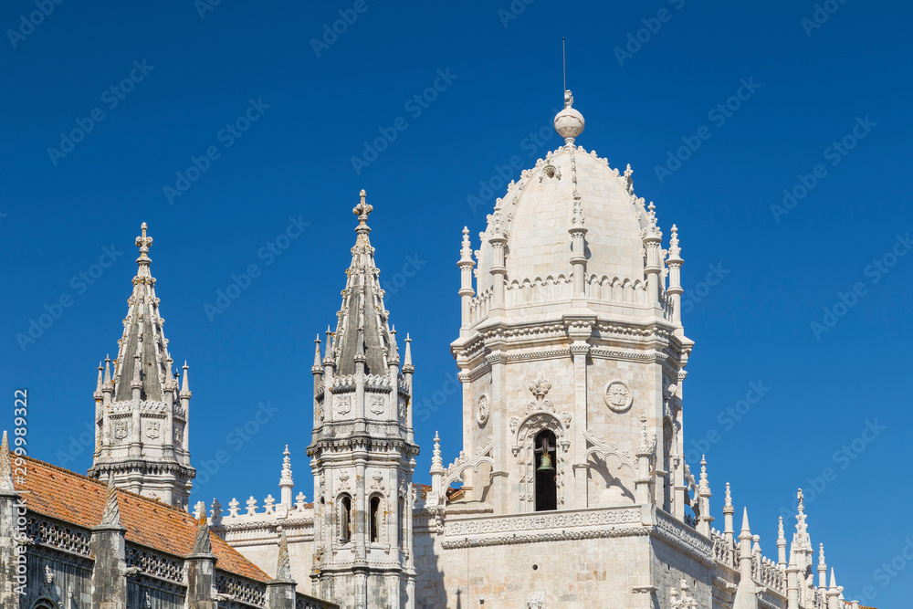 Close-up of towers of the historic Mosteiro dos Jeronimos (Jeronimos Monastery) in Belem, Lisbon, Portugal, on a sunny day.
