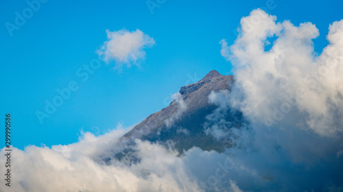 Distant view on the summit of Montanha do Pico, from Criacao Velha on Pico Island, Azores photo