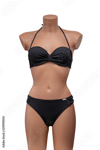 Swimsuit isolated. Close-up of elegant female sexy black swimsuit on a mannequin isolated on a white background. Fashionable bikini swimwear. Macro.