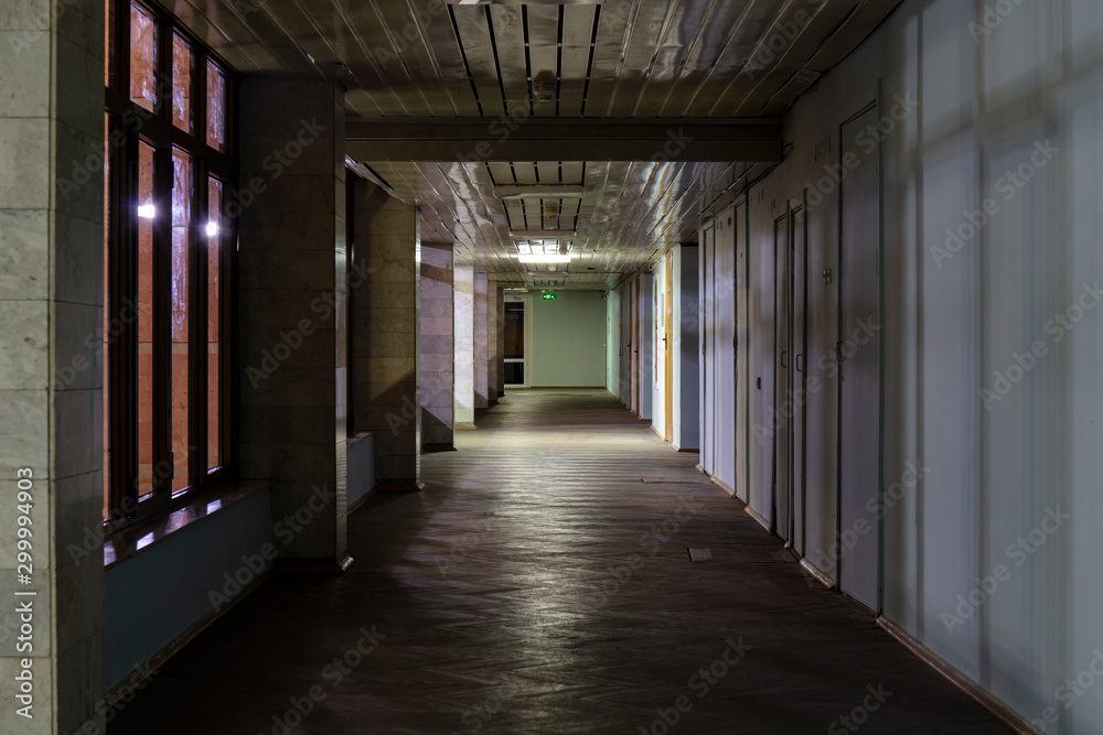 Long dark corridor in an old industrial building