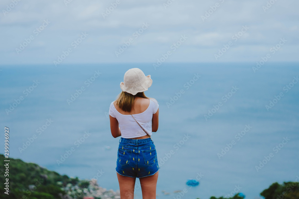 Woman relaxing on tropical sea and joy view natural seascape, Koh Tao, Summer vacation in Thailand, Beautiful destination place in Southeast Asia.