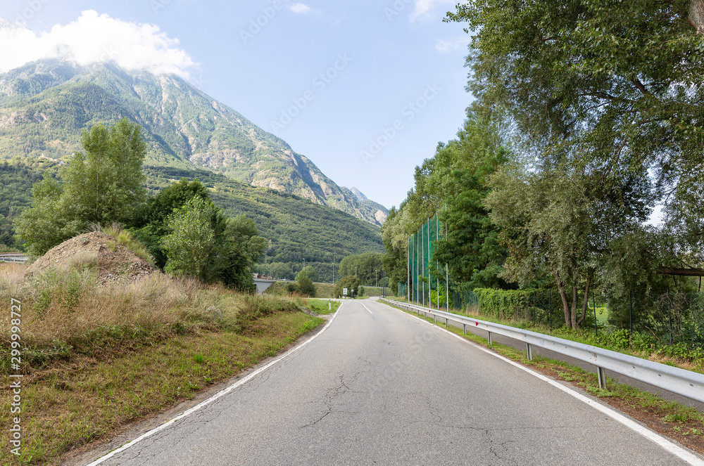 SR35 paved road close to the Golf Les Iles field, Brissogne, Aosta Valley, Italy