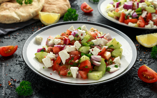 Turkish Shepards Salad with cucumber  tomato  red onion  pepper  parsley pita bread and Feta cheese