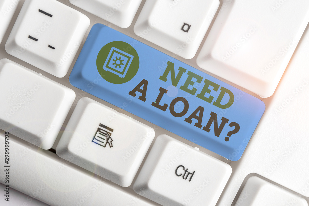 Text sign showing Need A Loan Question. Business photo text asking he need money expected paid back with interest White pc keyboard with empty note paper above white background key copy space Text sign showing Need A Loan Question. Business photo text asking he need money expected paid back with interest White pc keyboard with empty note paper above white background key copy space