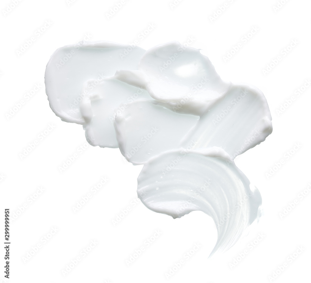 White texture and smear of face cream or white acrylic paint isolated on white background White texture and smear of face cream or white acrylic paint isolated on white background