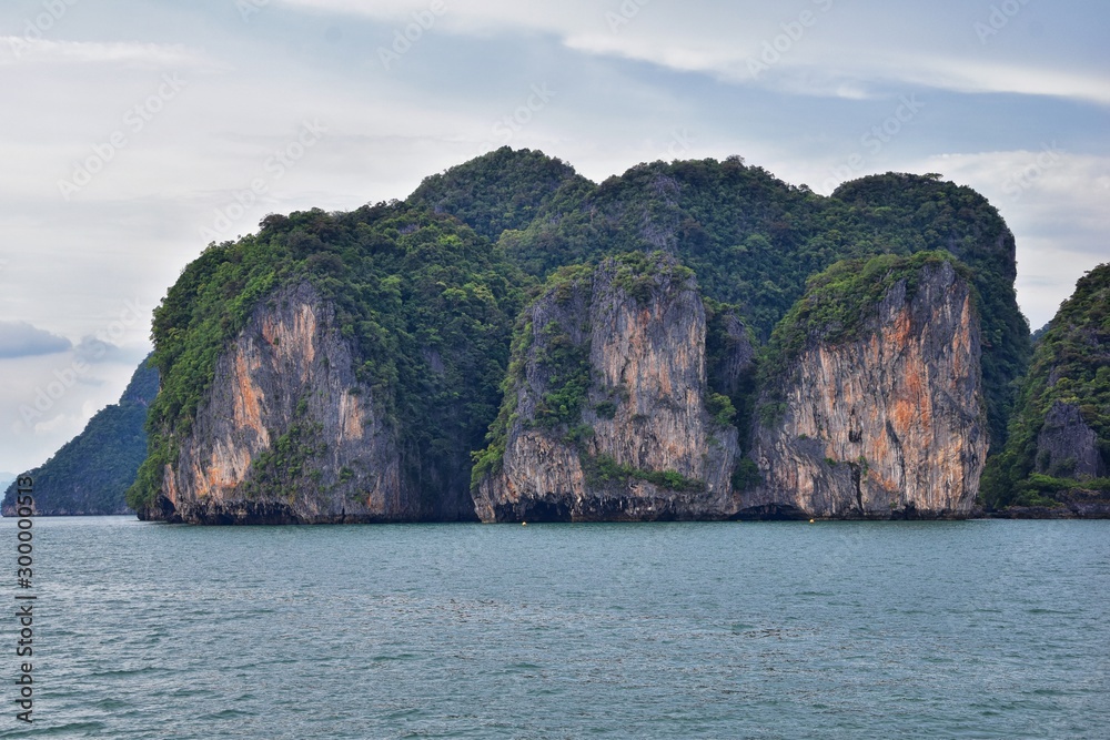 Island, Ocean views near Phuket Thailand with Blues, Turquoise and Greens oceans, mountains, boats, caves, trees resort island of phuket Thailand. Including Phi Phi, Ko Rang Yai, Ko Li Pe and other is Island, Ocean views near Phuket Thailand with Blues, Turquoise and Greens oceans, mountains, boats, caves, trees resort island of phuket Thailand. Including Phi Phi, Ko Rang Yai, Ko Li Pe and other is