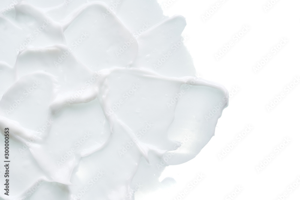 White texture and smear of face cream or white acrylic paint isolated on white background White texture and smear of face cream or white acrylic paint isolated on white background