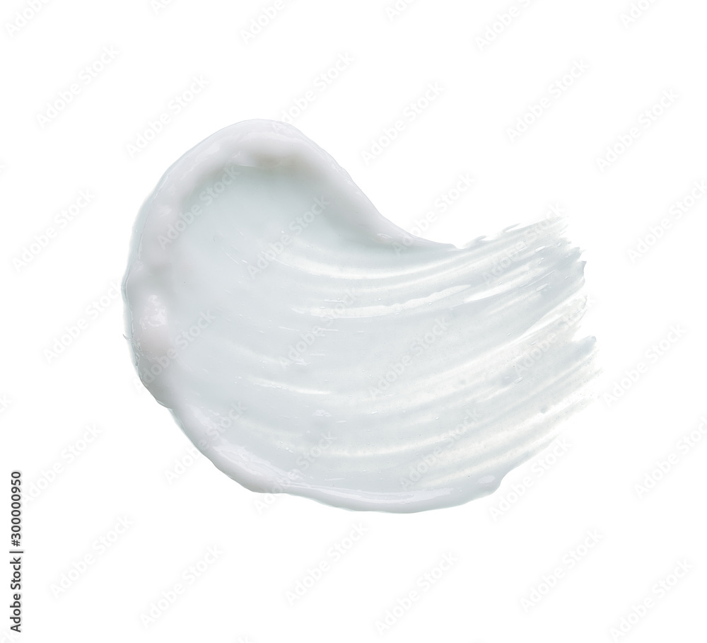 White texture and smear of face cream or white acrylic paint isolated on white background
