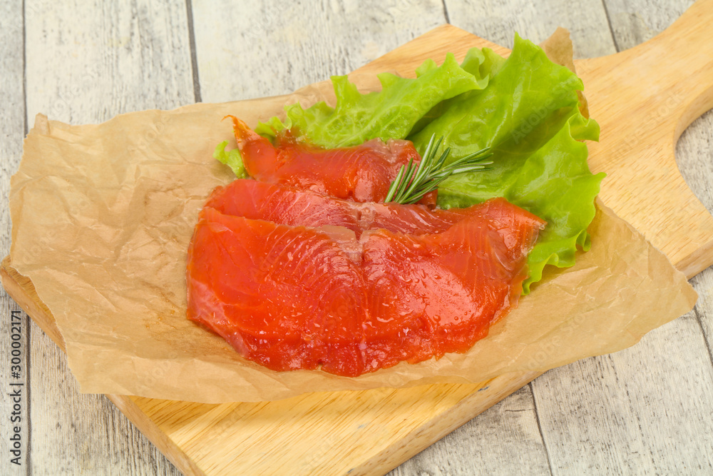 Sliced salmon fillet served rosemary Sliced salmon fillet served rosemary